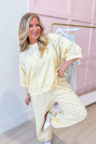Frederick butter yellow polka dot pullover sweatshirt by PEACH LOVE featuring a cozy solid design and playful polka dot pattern.