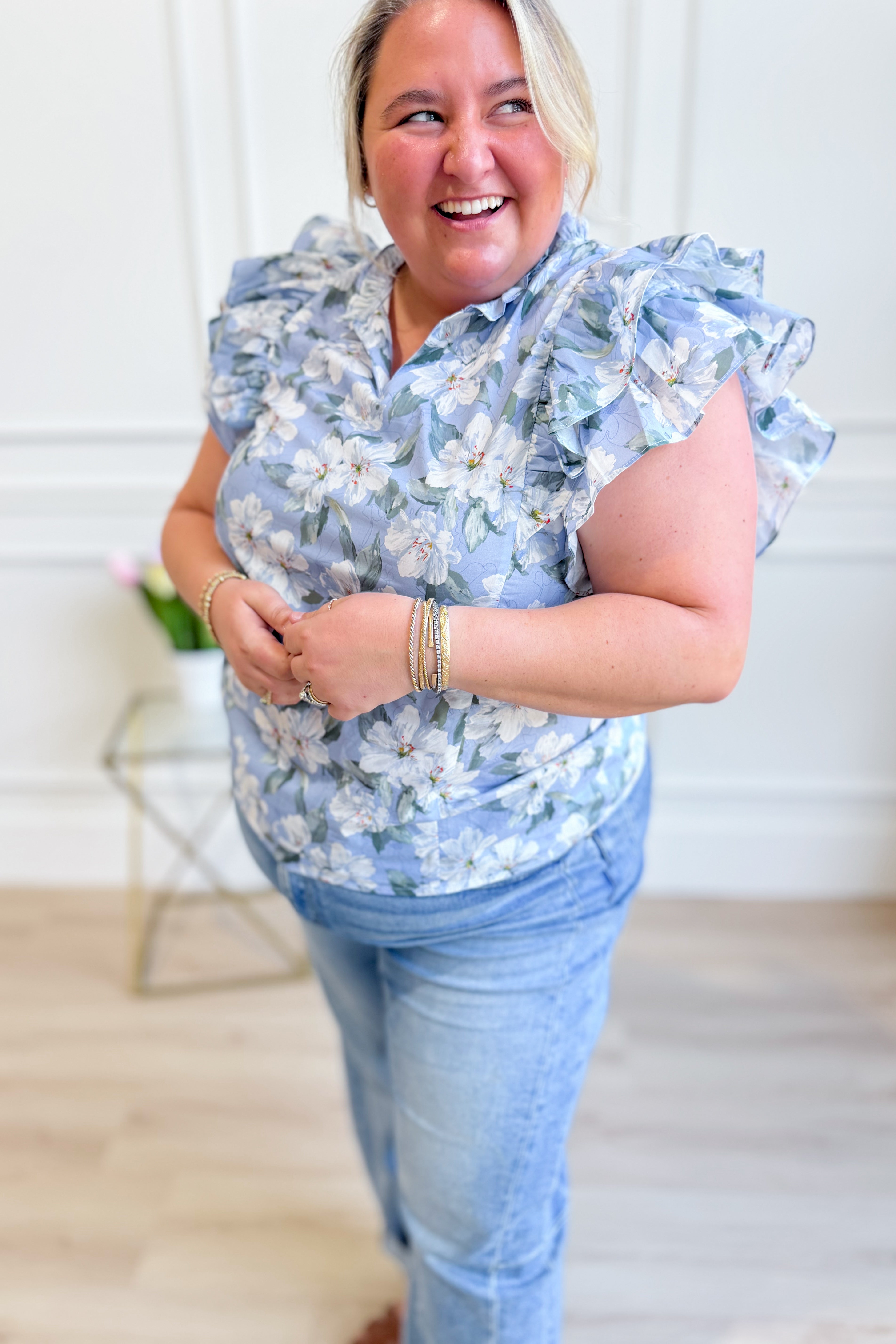SHE + SKY Lori printed top with ruffle sleeves, featuring colorful spring floral print, casual chic women’s blouse.