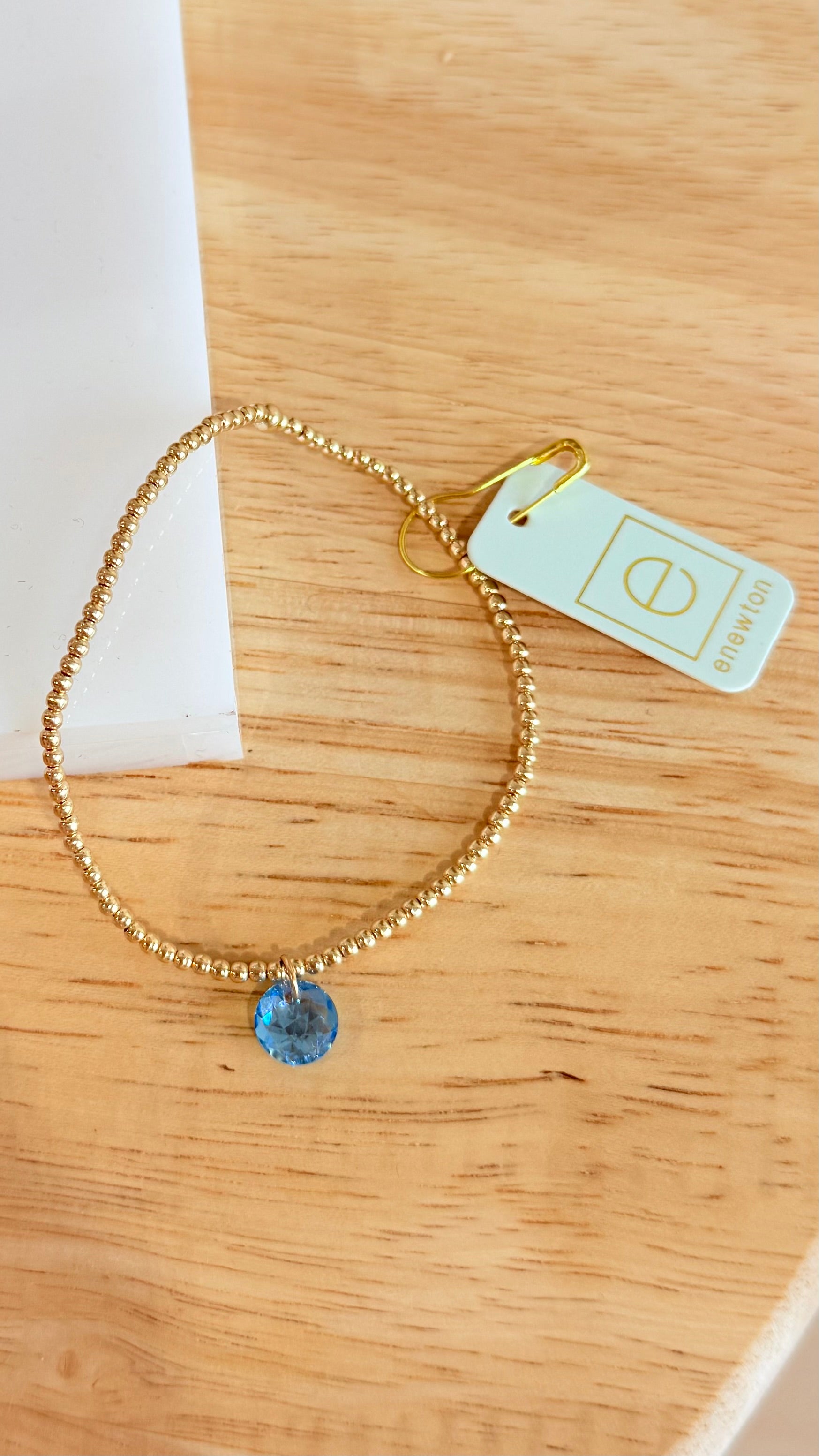 Enewton 2mm classic birthstone bracelet with colorful stones on a silver chain, showcasing elegant jewelry design.