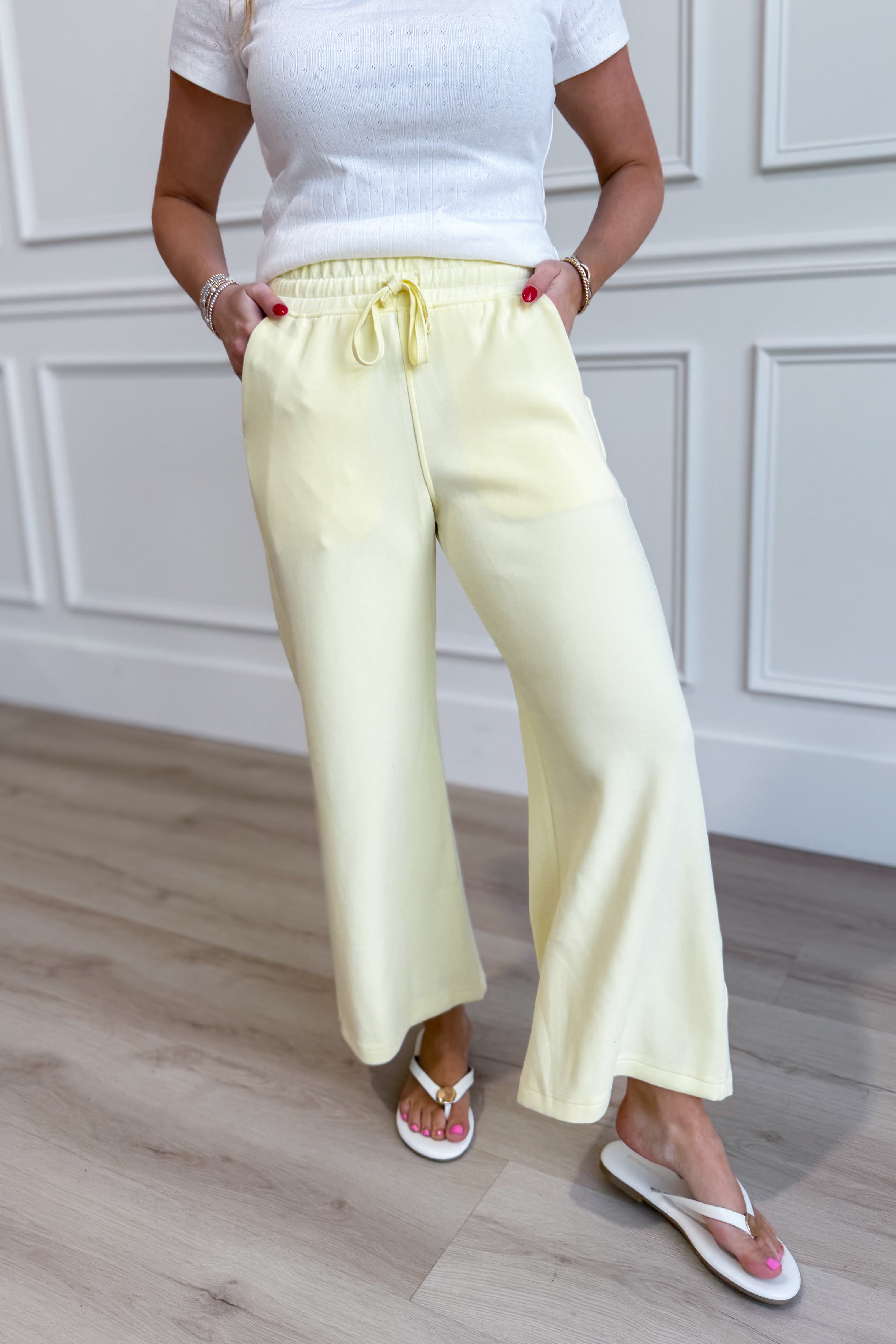 Raé Mode Norma Lemon Cropped Wide Leg Pants displayed on a model, showcasing their relaxed fit and stylish wide leg design.