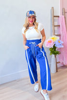 BUCKET LIST Lenny Blue Windbreaker with contrasted stripe pant, 156 Pants, stylish outdoor clothing with vibrant design details.