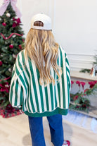 Reversible green sweatshirt with Merry and striped graphic design from PEACH LOVE's 137 Graphic Sweatshirts collection.