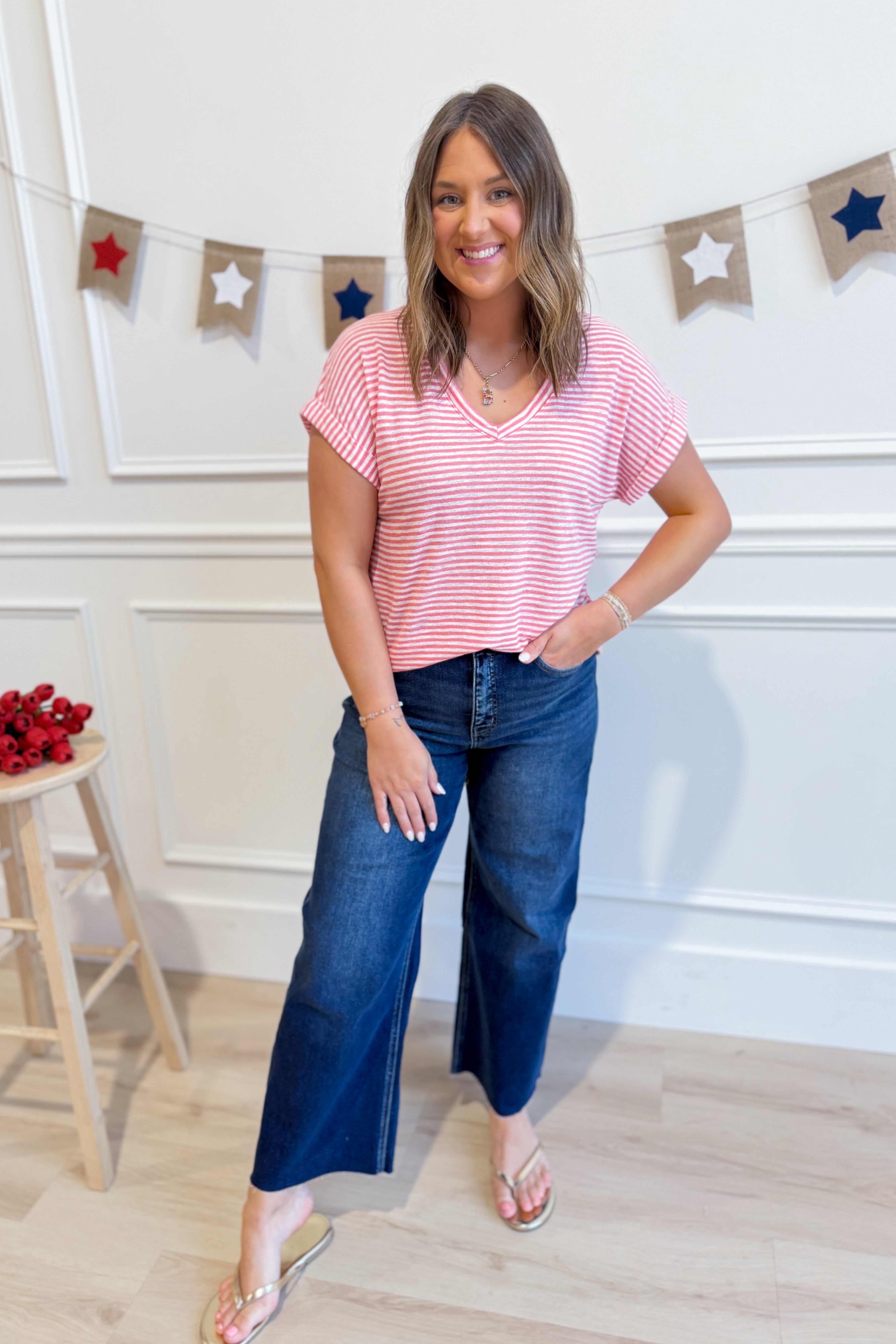 Wasabi & Mint Cindy striped short sleeve casual top with a relaxed fit, featuring colorful horizontal stripes and a round neckline.