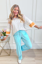 Relaxed fit Bella Cotton Barrel Pants by RAE MODE in natural cotton, shown in a casual style with a tapered leg design.