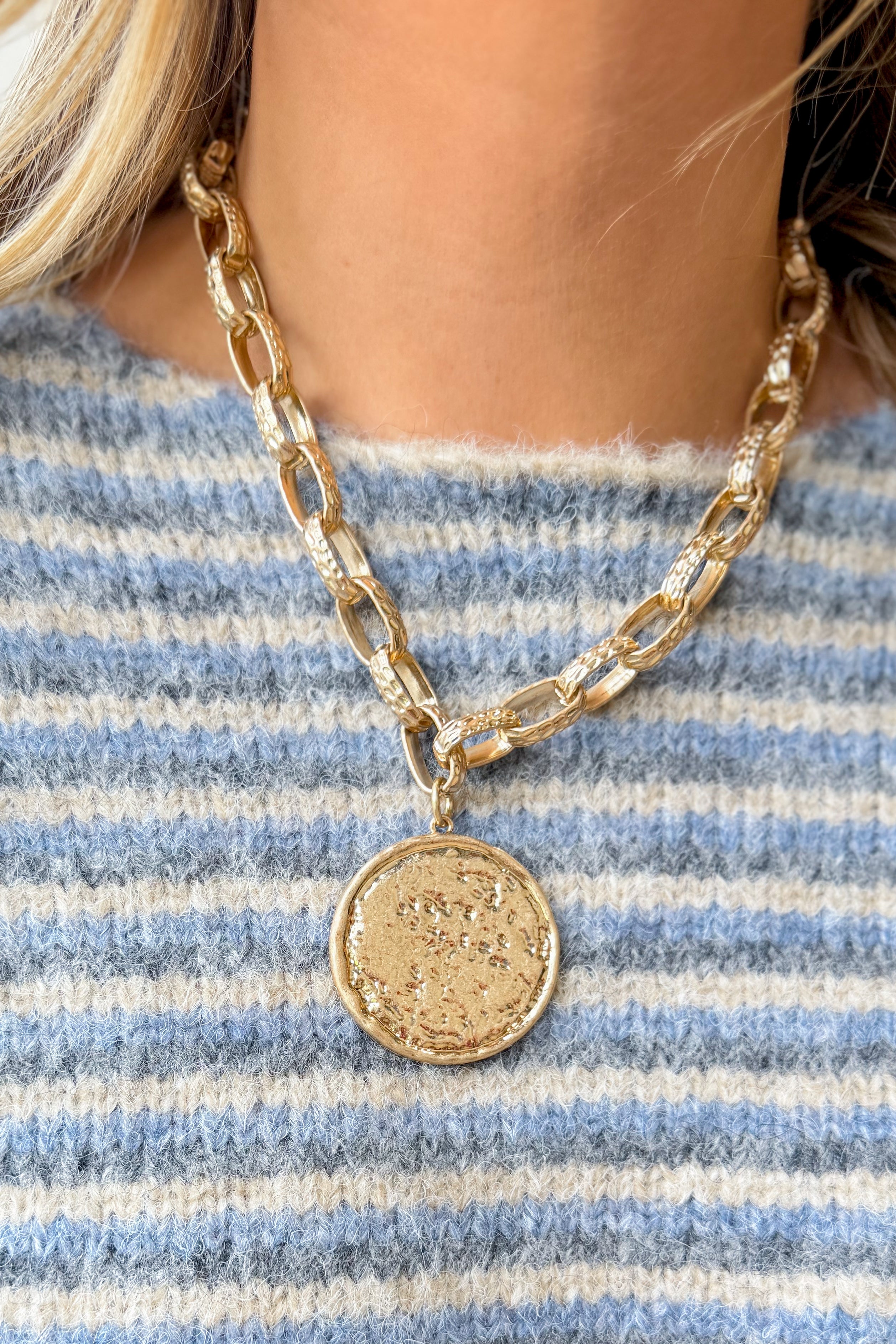 Caroline Hill Newcastle textured medallion necklace featuring a detailed round pendant on a chain, stylish jewelry for accessorizing.