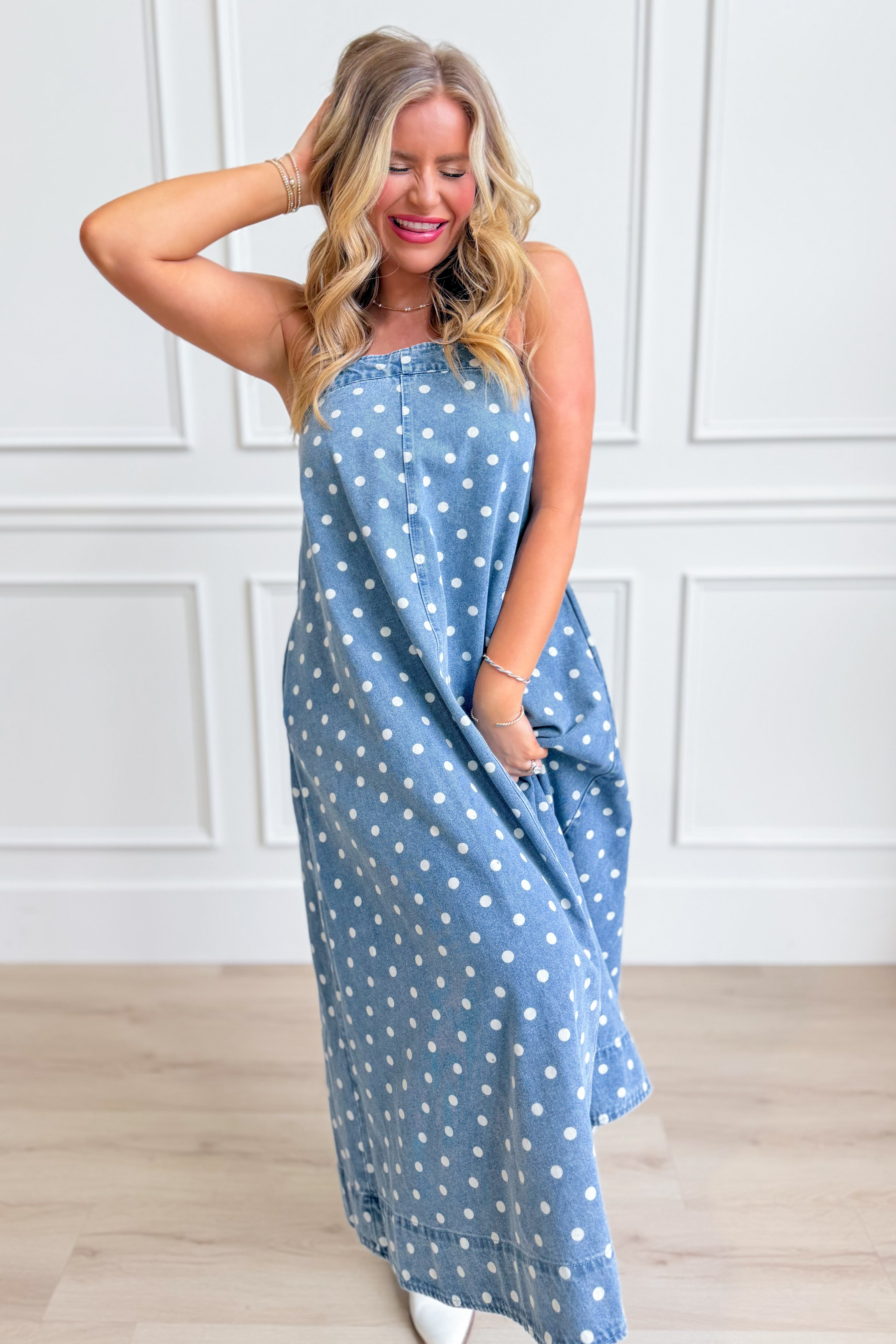 Aureum Mia polka dot denim dress with a fitted bodice and flared skirt, featuring classic polka dot pattern and stylish design.