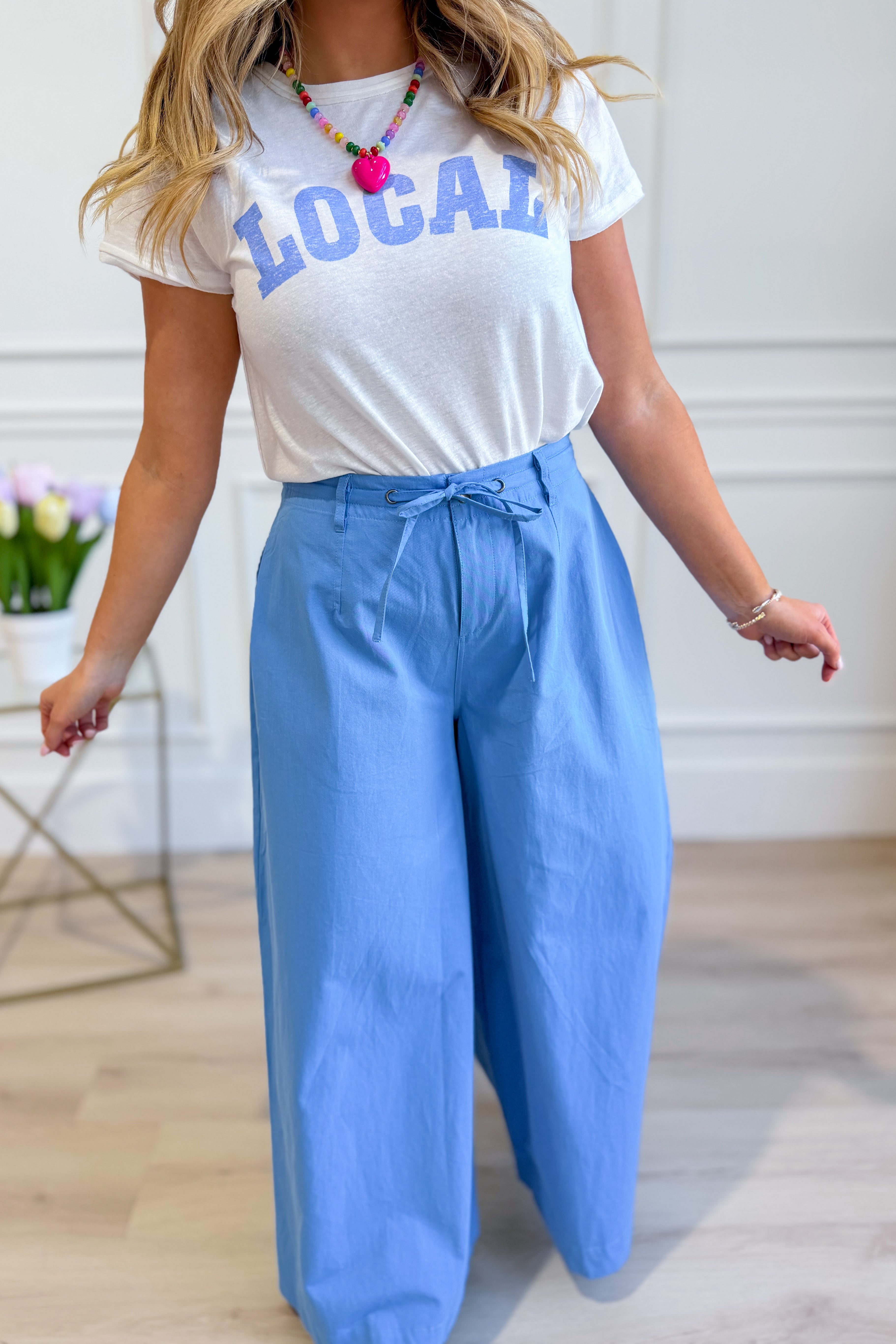 WISHLIST Reese wide-leg drawstring pants in a relaxed fit, featuring a comfortable waistband and flowing fabric.