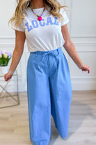 WISHLIST Reese wide-leg drawstring pants in a relaxed fit, featuring a comfortable waistband and flowing fabric.