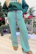 Rudy Green Striped Holiday Pants by BUCKET LIST, stylish 156 pants featuring festive green and white stripe pattern.