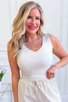 Wasabi & Mint Palmer Oat fitted V-neck tank top, casual 105 top, shown in neutral color with sleeveless design and fitted silhouette.
