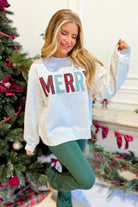 Everleigh Merry multi-colored graphic sweatshirt by TWENTIFOURTH, featuring vibrant, playful design on a cozy pullover.