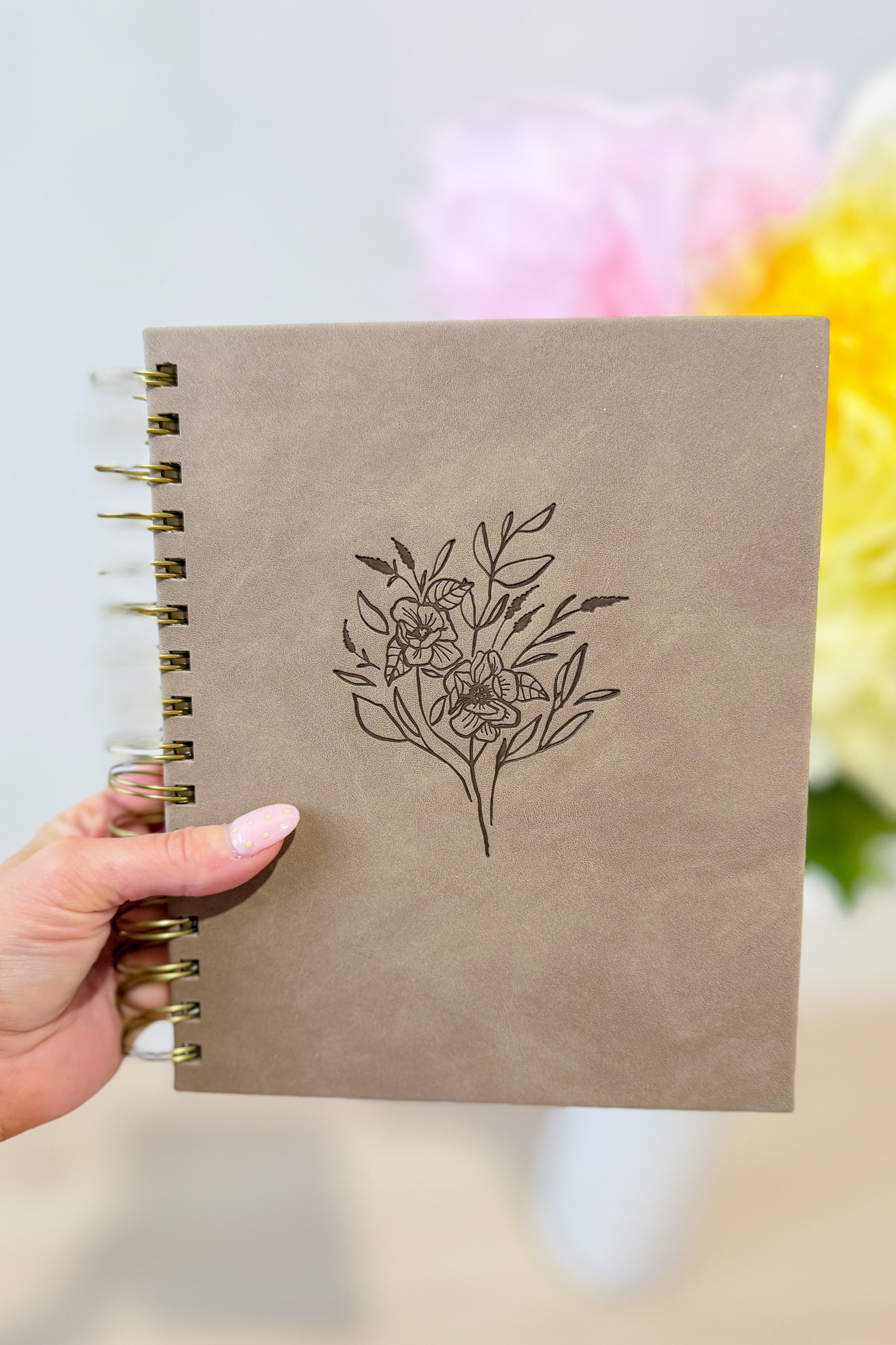 Undated 12-month planner by HOSANNA REVIVAL, Marlo style, with a sleek cover and internal monthly and weekly planning pages.