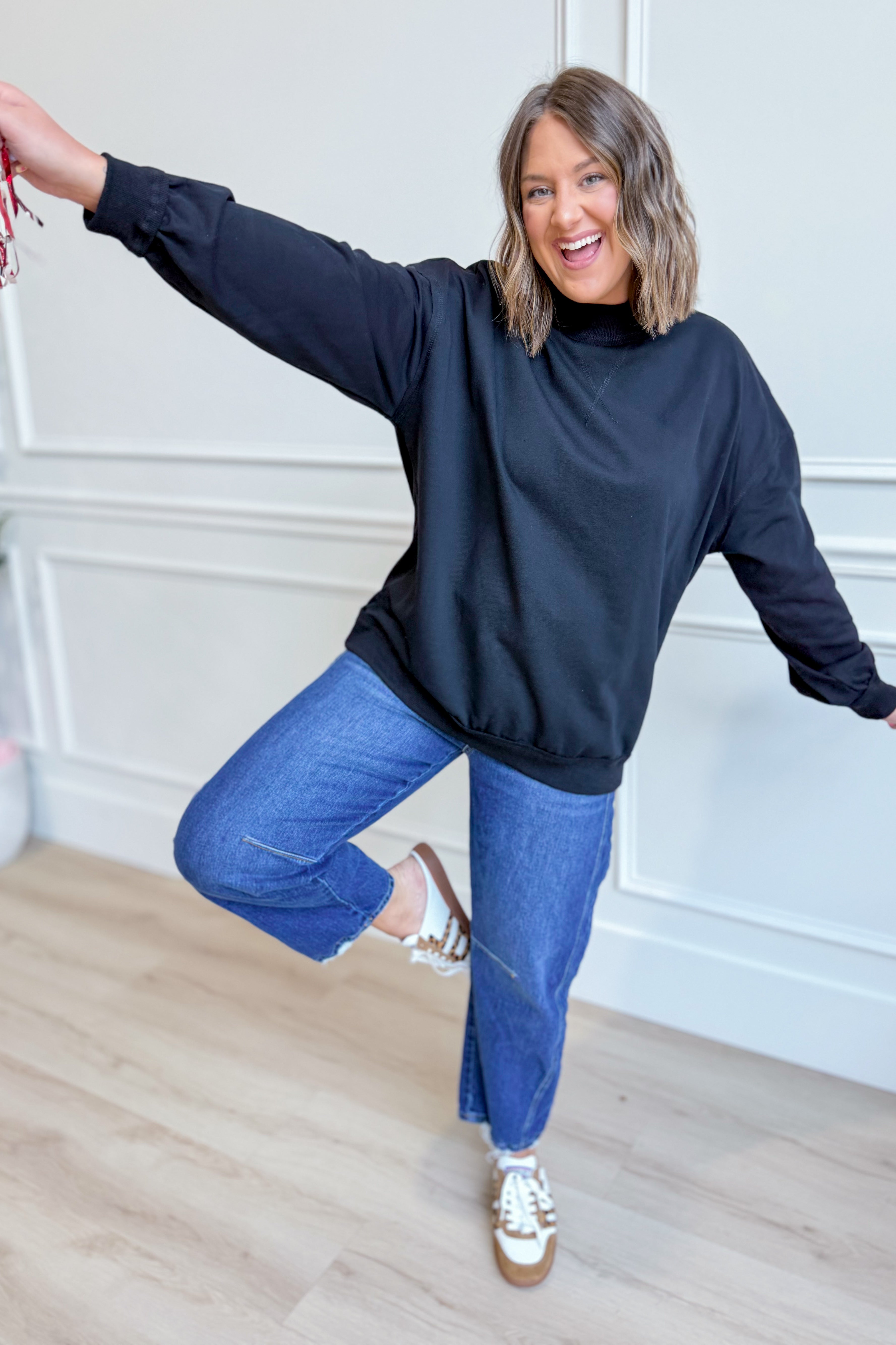 Black Cynthia Game Day Pullover from PEACH LOVE, a 137 graphic sweatshirt with bold sports-themed design.