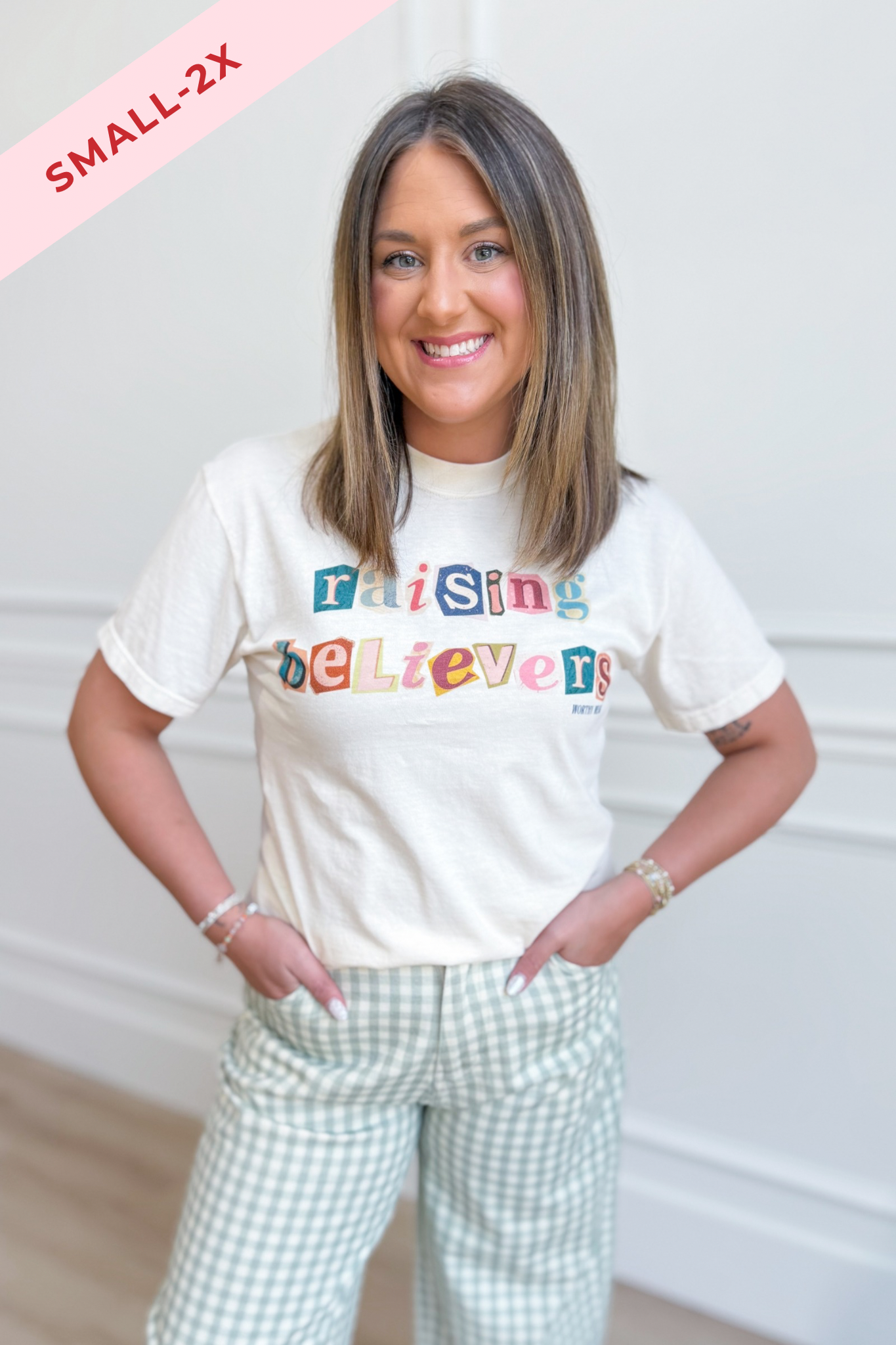 Raising Believers graphic t-shirt by Worthy Wear featuring bold design on a casual 117 Graphic Tees shirt.