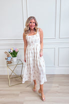 BLU PEPPER Addison floral sleeveless midi dress with a fitted waist and vibrant floral pattern, perfect for elegant occasions.