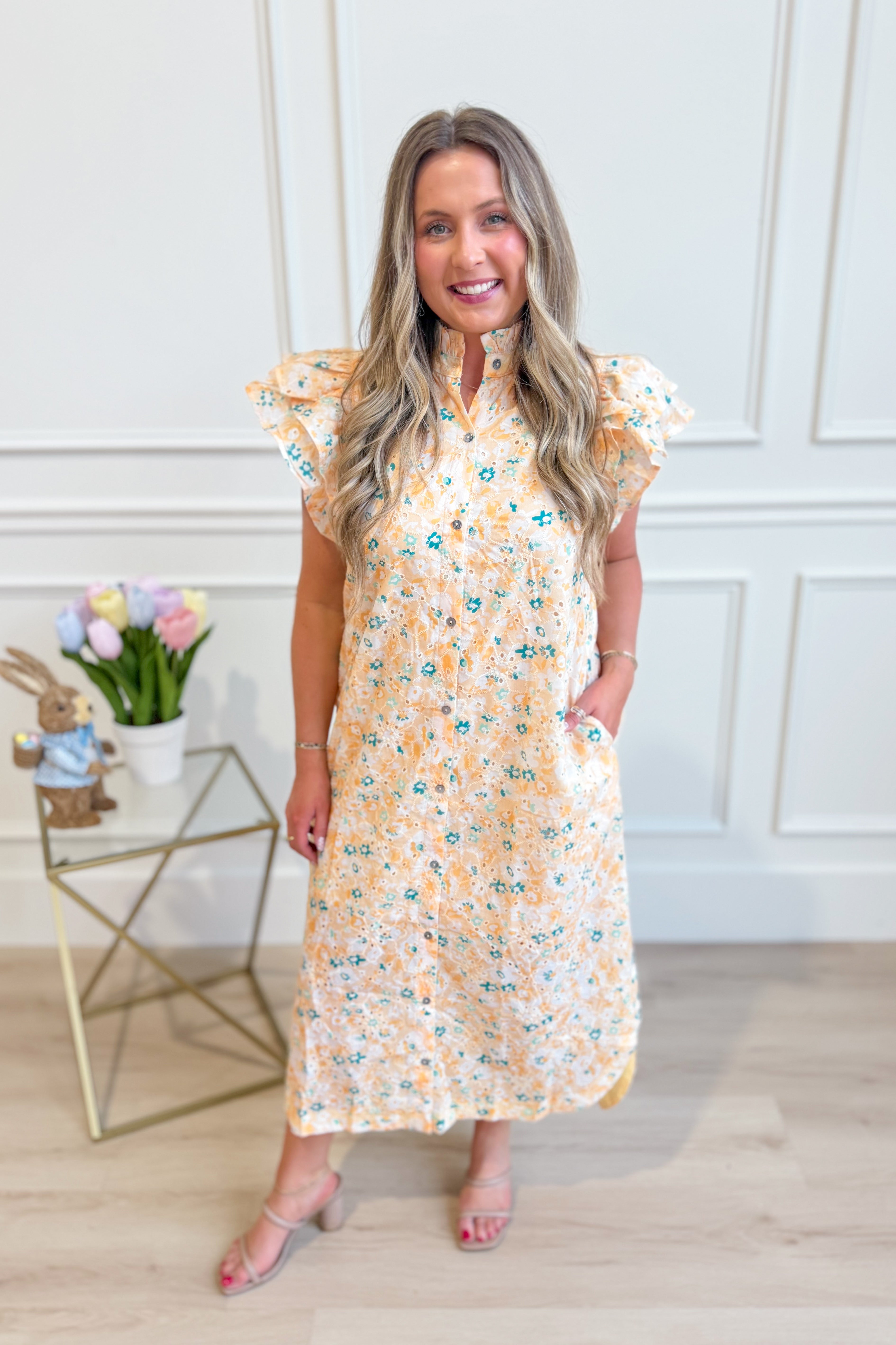 ENTRO Aubrey yellow floral flutter sleeve dress, lightweight and elegant for dressy occasions, with a vibrant floral pattern.