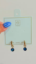 Enewton .5mm Classic Birthstone Huggie earrings featuring a small gemstone set in gold-tone jewelry.