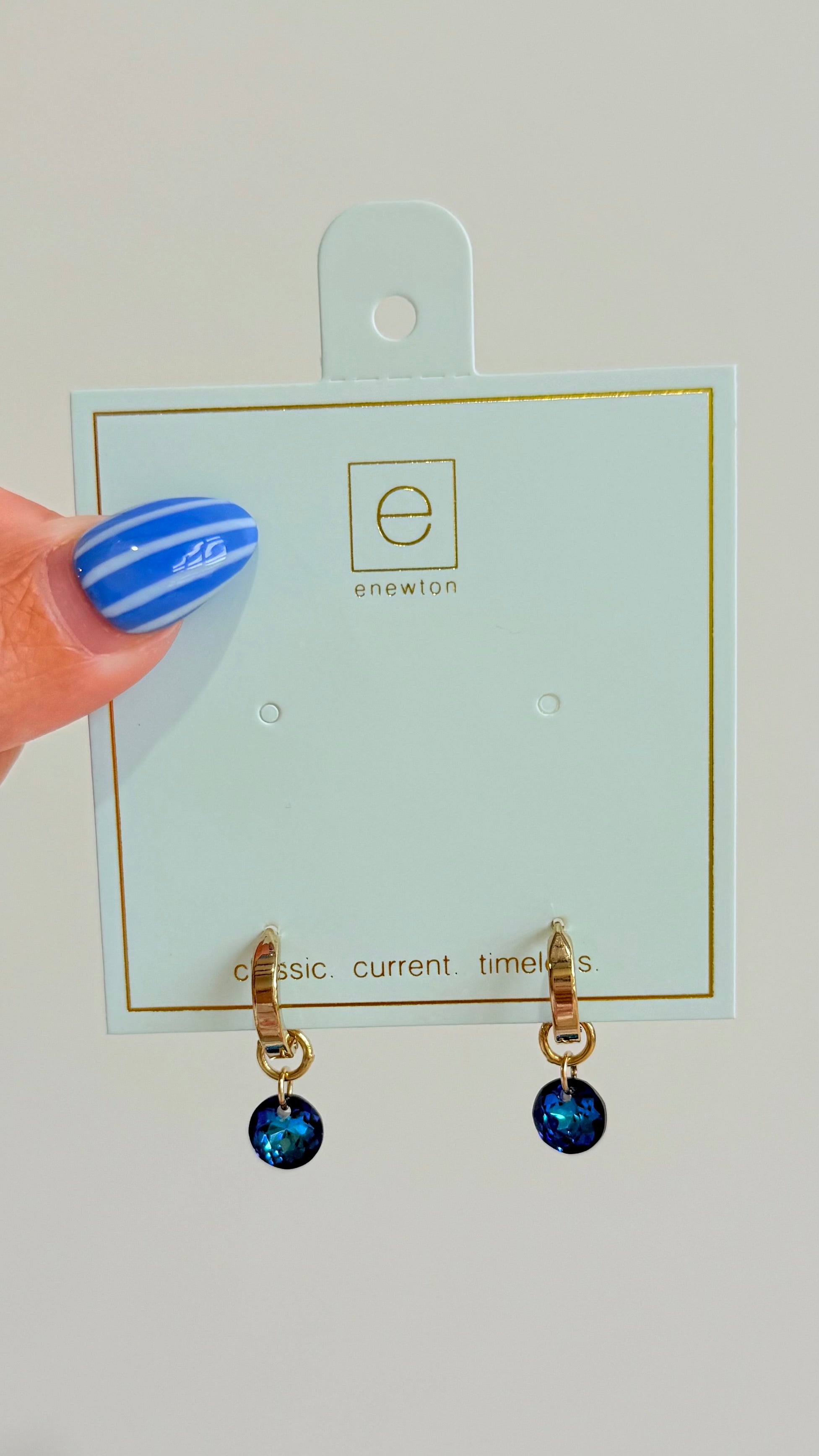 Enewton .5mm Classic Birthstone Huggie earrings featuring a small gemstone set in gold-tone jewelry.