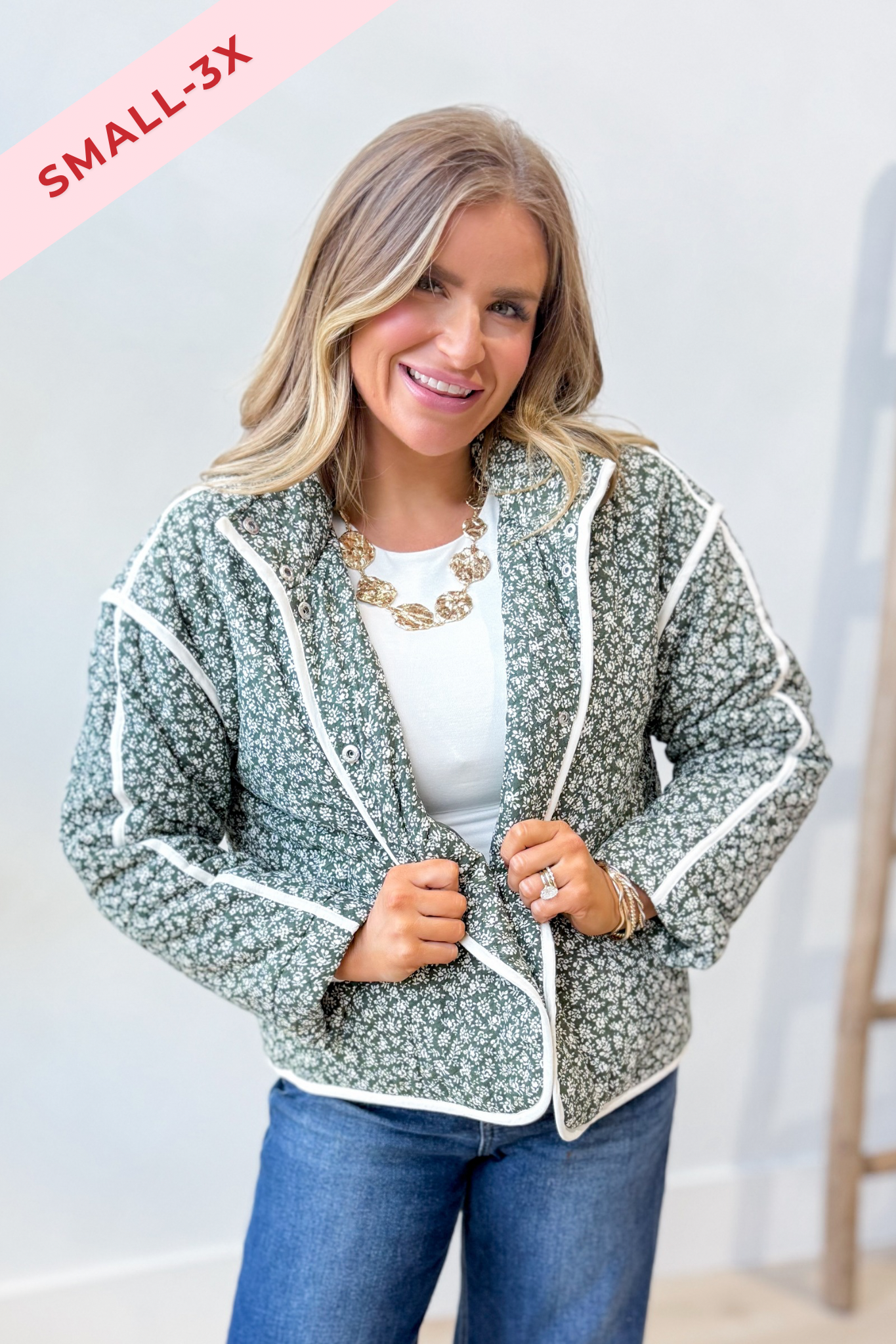 Baevly Xavier floral printed 140 outerwear jacket with colorful floral design and lightweight fabric, hanging on a hanger.