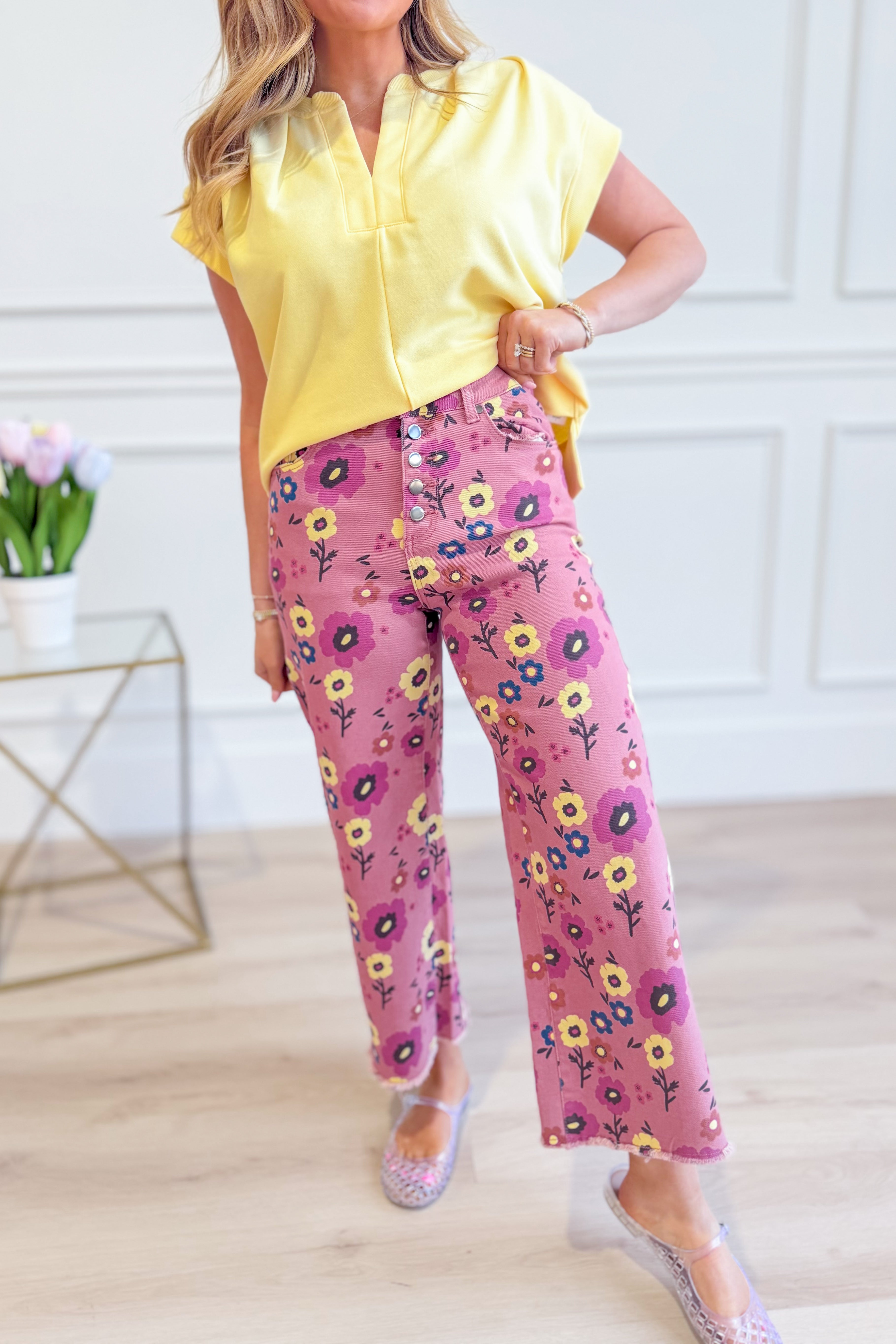 EASEL Eleanor Floral Wide Leg Pant with colorful floral pattern and relaxed fit, displayed on a hanger against a white background.