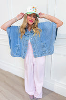 WISHLIST Fred denim cape jacket, 140 outerwear style, showcasing a stylish blue denim cape with a collar and button details.