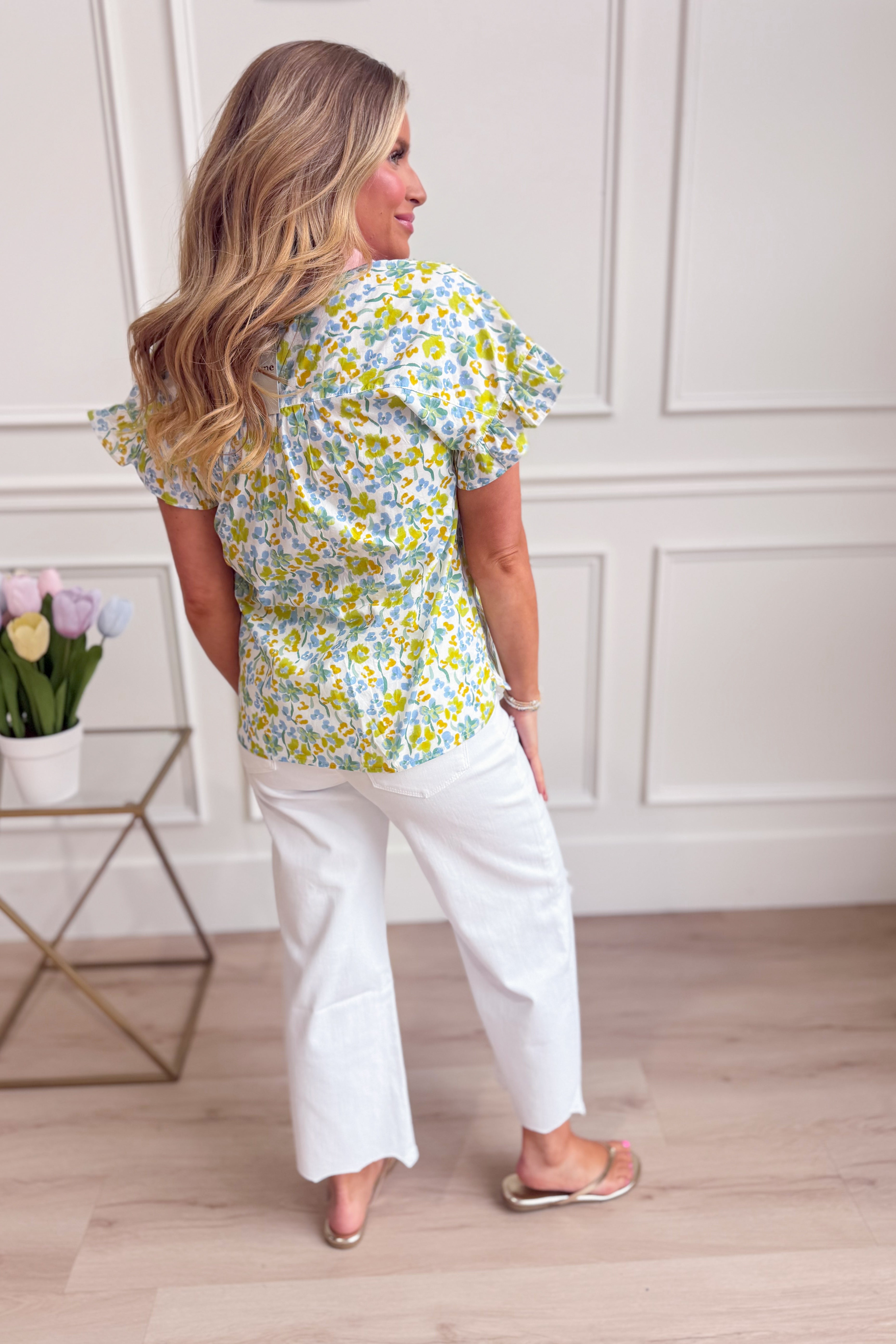 Tracey multi-color floral printed top from EE:SOME, showing the vibrant pattern and stylish design of this dressy top.