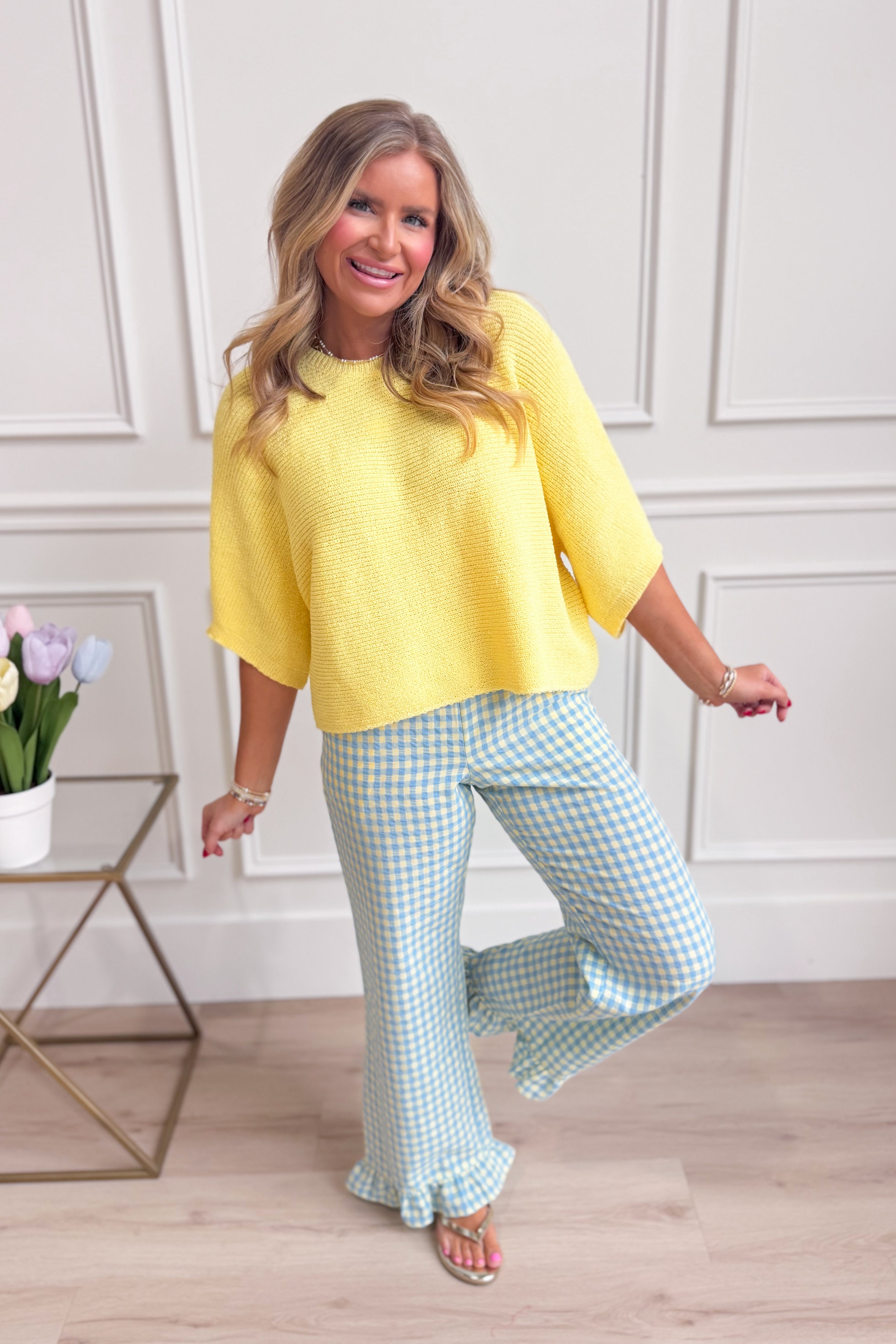 Candice Lemon knitted spring top by ENTRO, showcasing a casual, lightweight design with a textured knit pattern in soft yellow.