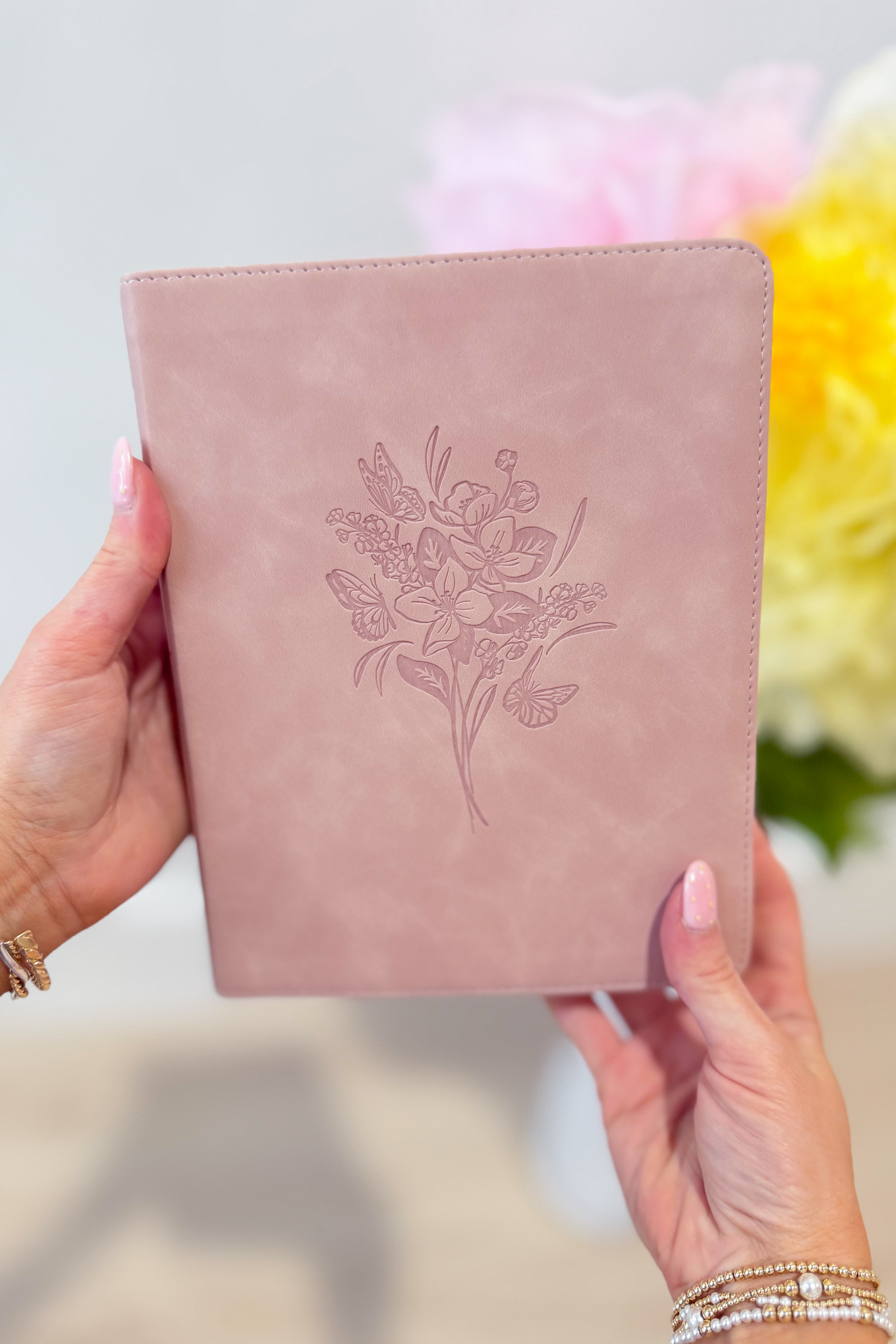 HOSANNA REVIVAL NLT Notetaking Bible with cover and open pages showing lined notes sections and detailed text.