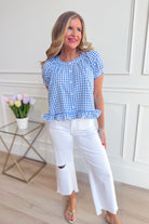 LE LIS Monica short puff sleeve gingham top in casual 105 style, featuring a classic checkered pattern and feminine puff sleeves.