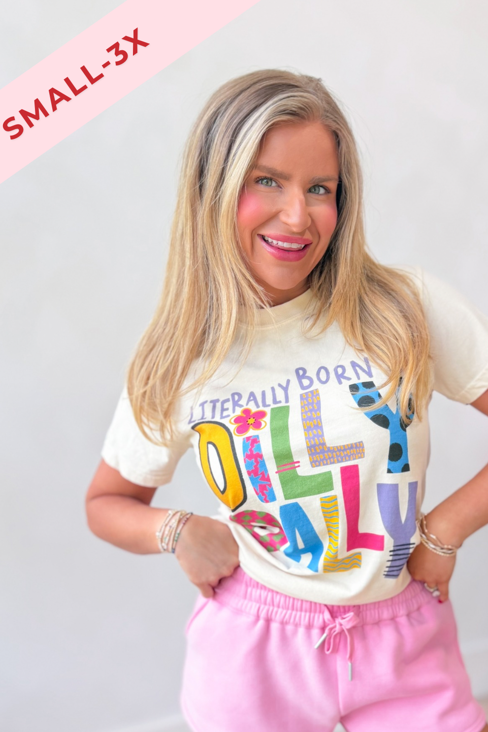 Literally Born To Dilly Dally graphic T-shirt by POPPY & PINE, featuring playful text and casual style in a vibrant design.