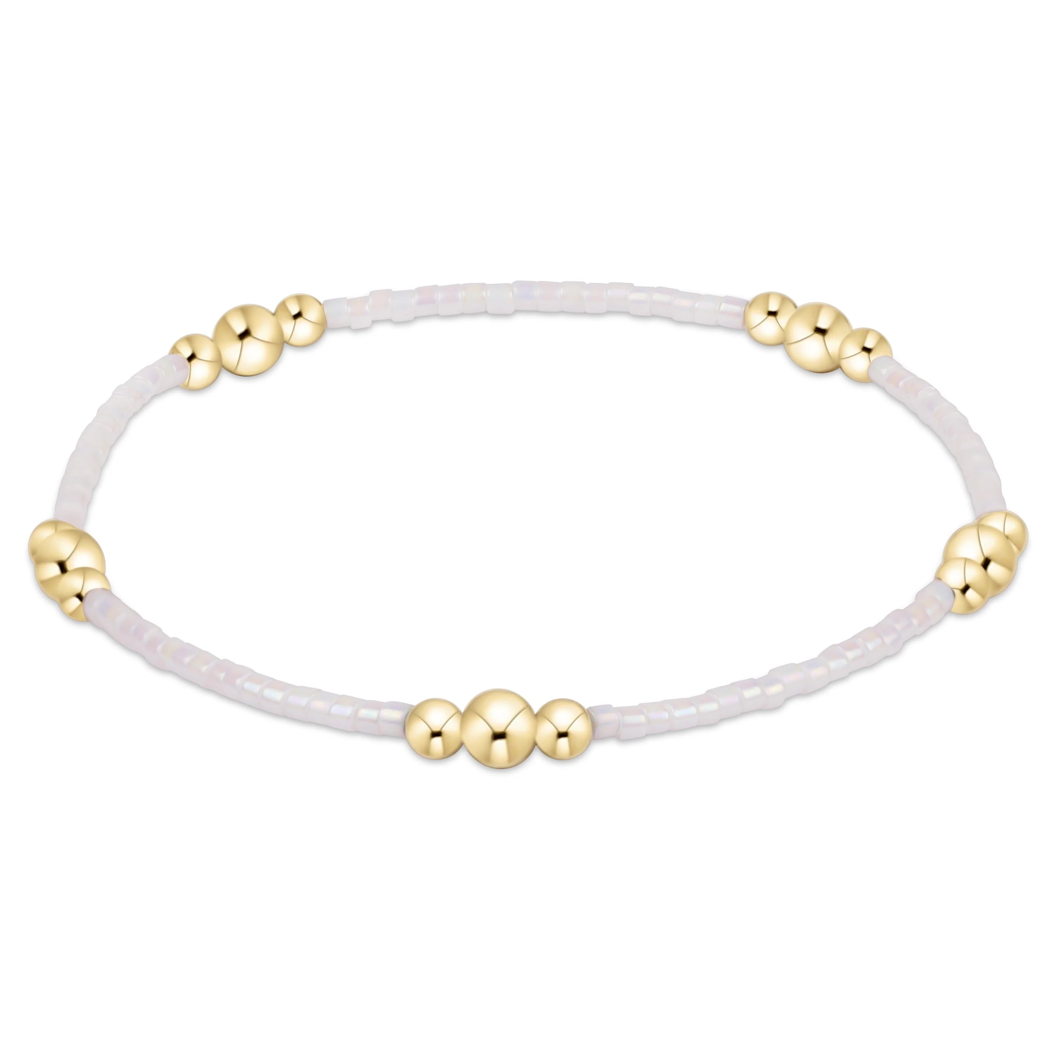 Enewton Silky White Hope Purpose Gold Bracelet featuring sleek gold band and elegant design, on a neutral background.