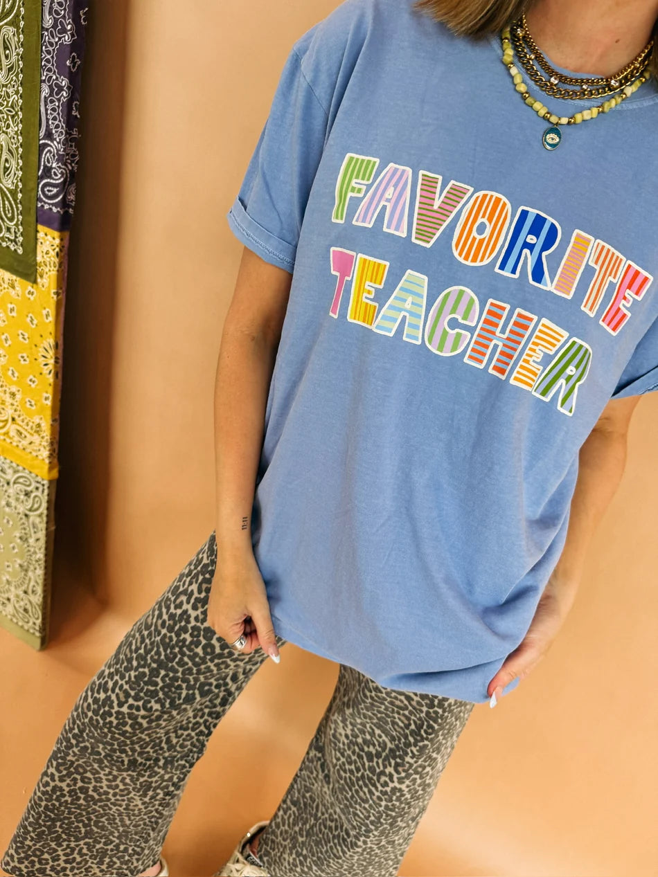 Favorite Teacher graphic T-shirt from ETTA & EAST, featuring a colorful school-themed design on a casual cotton tee.