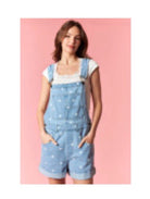 PEACH LOVE Holly polka dot denim overall romper displayed on a hanger, featuring a playful polka dot pattern and adjustable straps.