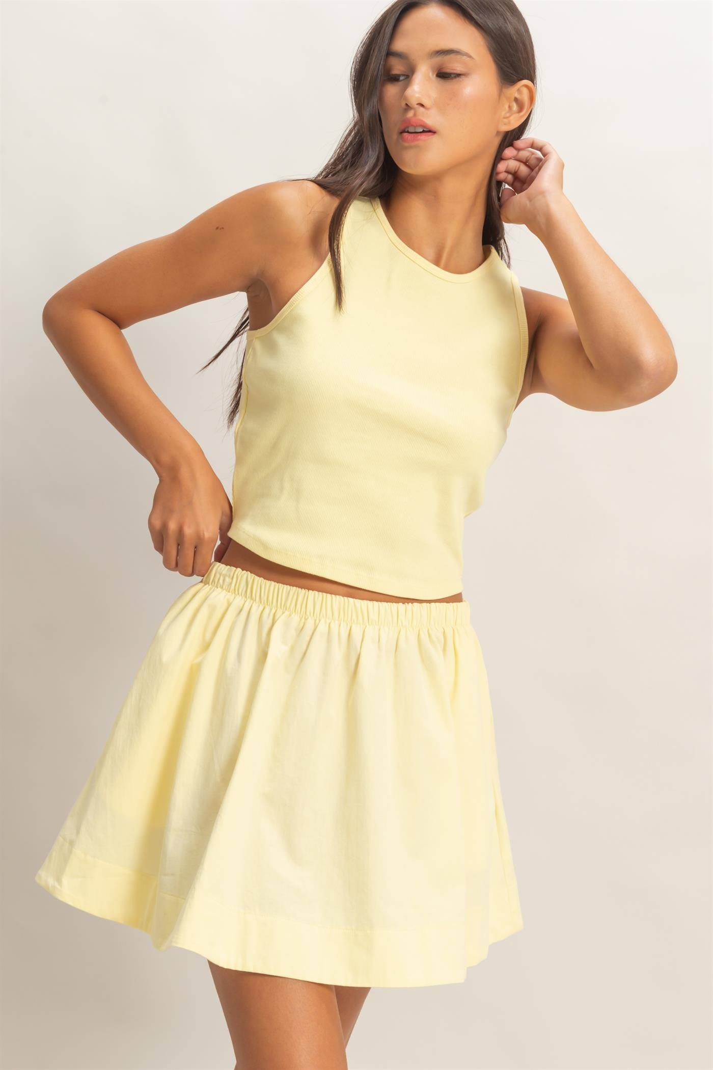 Yellow sleeveless ribbed skirt set by HYFVE featuring a fitted skirt and matching top, styled for casual or summer wear.