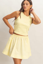 Yellow sleeveless ribbed skirt set by HYFVE featuring a fitted skirt and matching top, styled for casual or summer wear.