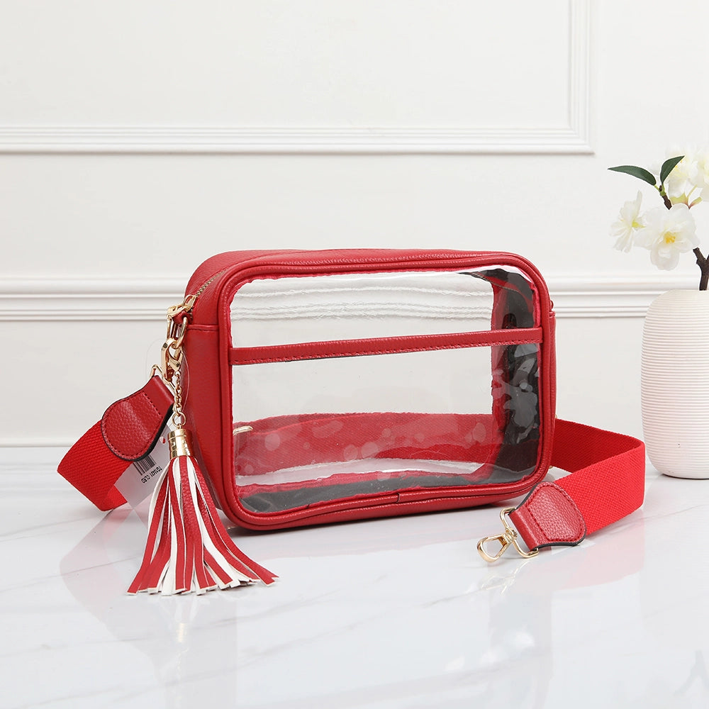 Red clear stadium crossbody bag by QUEENS DESIGNS featuring transparent material and adjustable strap, ideal for sporting events.