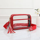 Red clear stadium crossbody bag by QUEENS DESIGNS featuring transparent material and adjustable strap, ideal for sporting events.