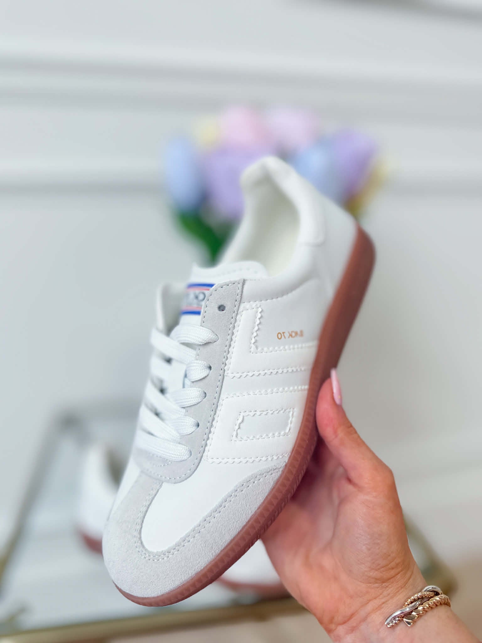 White Ice BACK70 Cloud Sneakers, 205 model, showcasing sleek design and comfortable fit in a close-up view.