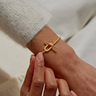 A LITTLES & CO Evermore Oval T Bar Bracelet with sleek oval links and T bar clasp, stylish jewelry accessory.