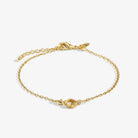 A LITTLES & CO Evermore Linked Knot bracelet with interconnected metal links, showcasing a stylish jewelry accessory.