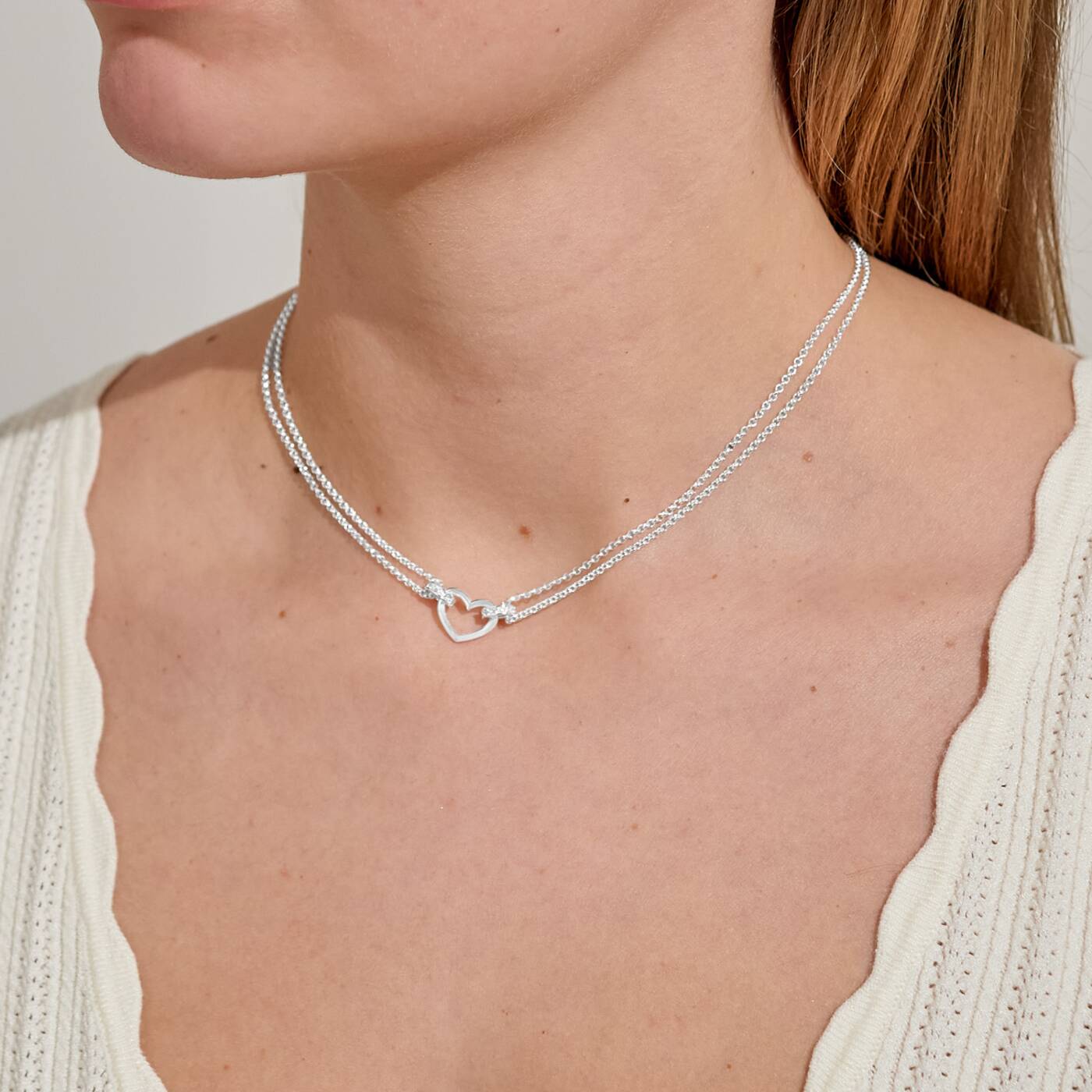 A LITTLES & CO Evermore Heart 15 3/4-inch necklace with a delicate heart pendant on a fine chain.