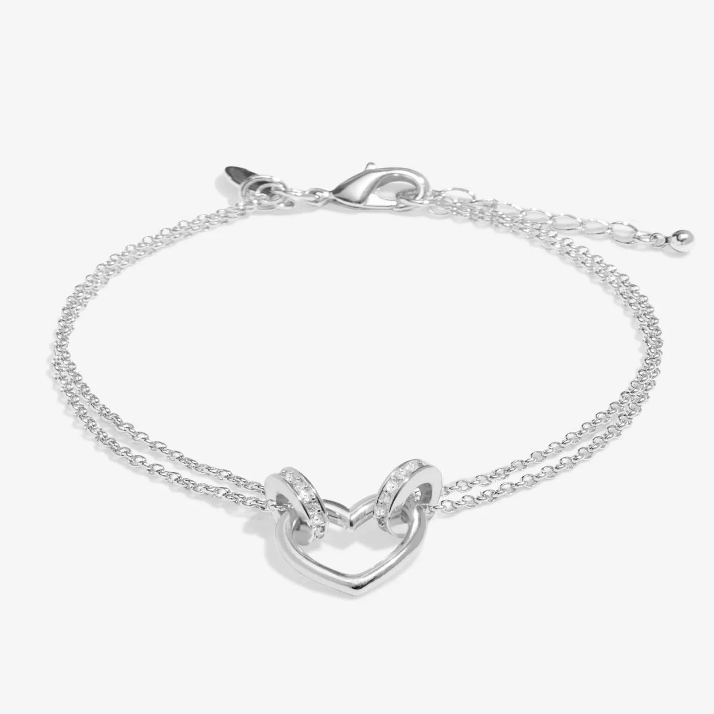 A delicate Evermore Heart bracelet by A LITTLES & CO featuring a silver heart charm on a fine chain.