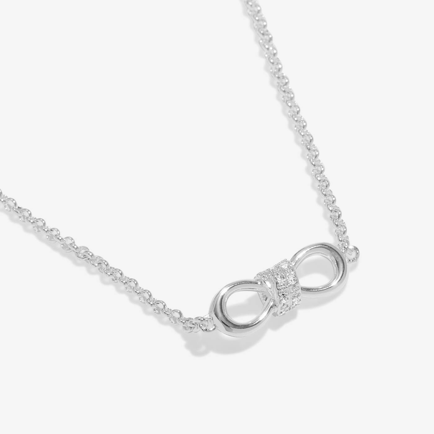 A LITTLES & CO Evermore Infinity Knot 15 3/4-inch necklace with a sleek silver infinity knot pendant on a chain.