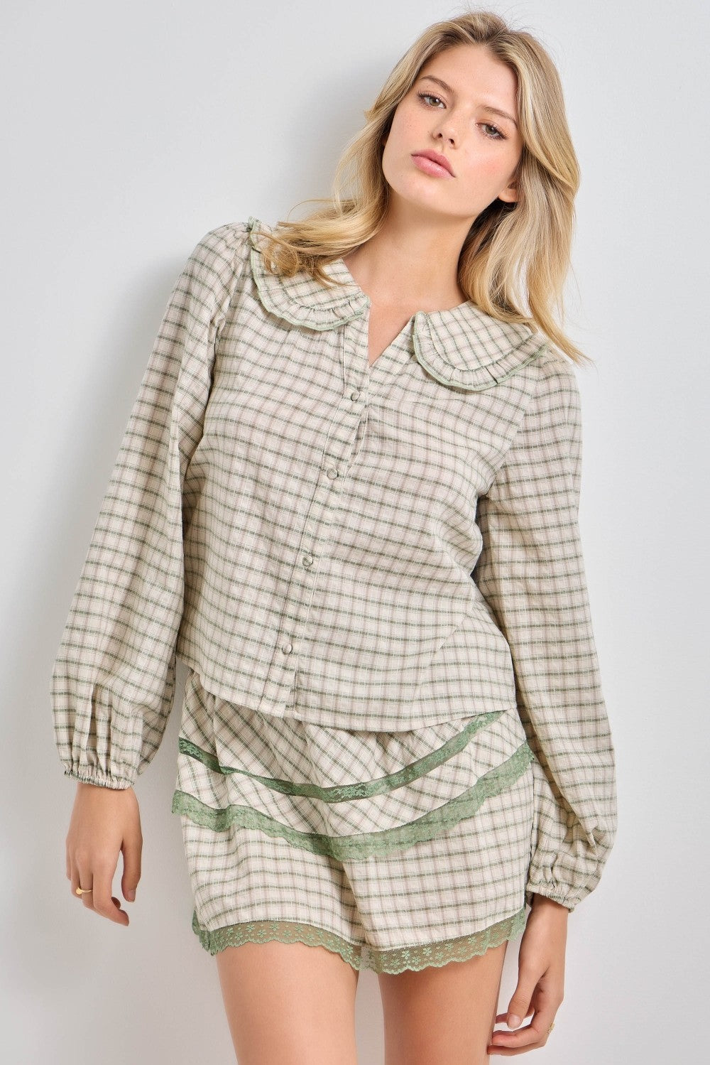 Baevely Manny plaid button-up sweater in fall-inspired colors, featuring a classic plaid pattern and button-front design.