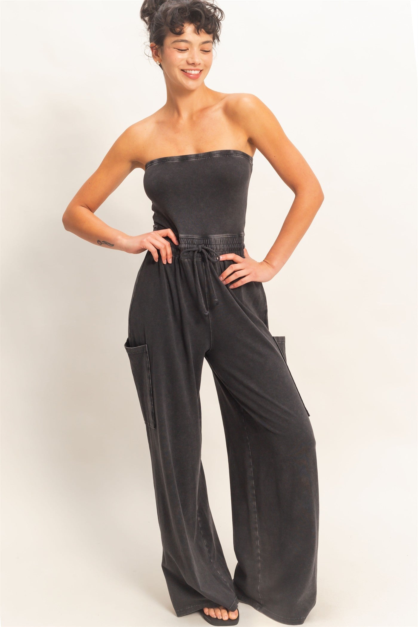 Hydrating Joni strapless mineral washed jumpsuit by HYFVE displayed on a hanger with a relaxed fit and casual style.