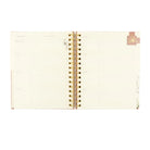 Undated 12-month Sonora planner by HOSANNA REVIVAL with 218 accessories, featuring a sleek cover and organized layout.