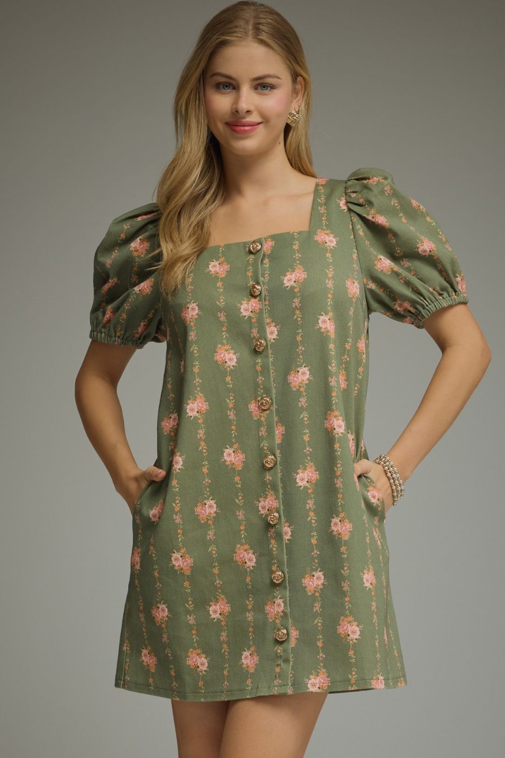 ENTRO Kelly floral button-down dress with long sleeves and a fitted waist, featuring a vibrant floral pattern.