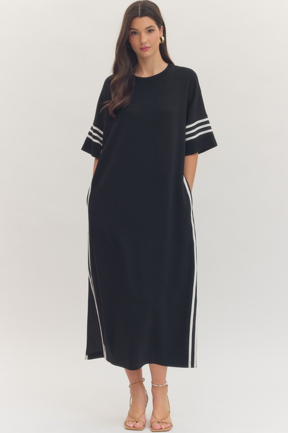 Black and white striped ENTRO Junie midi dress with contrasting sleeve details, stylish casual dress for everyday wear.