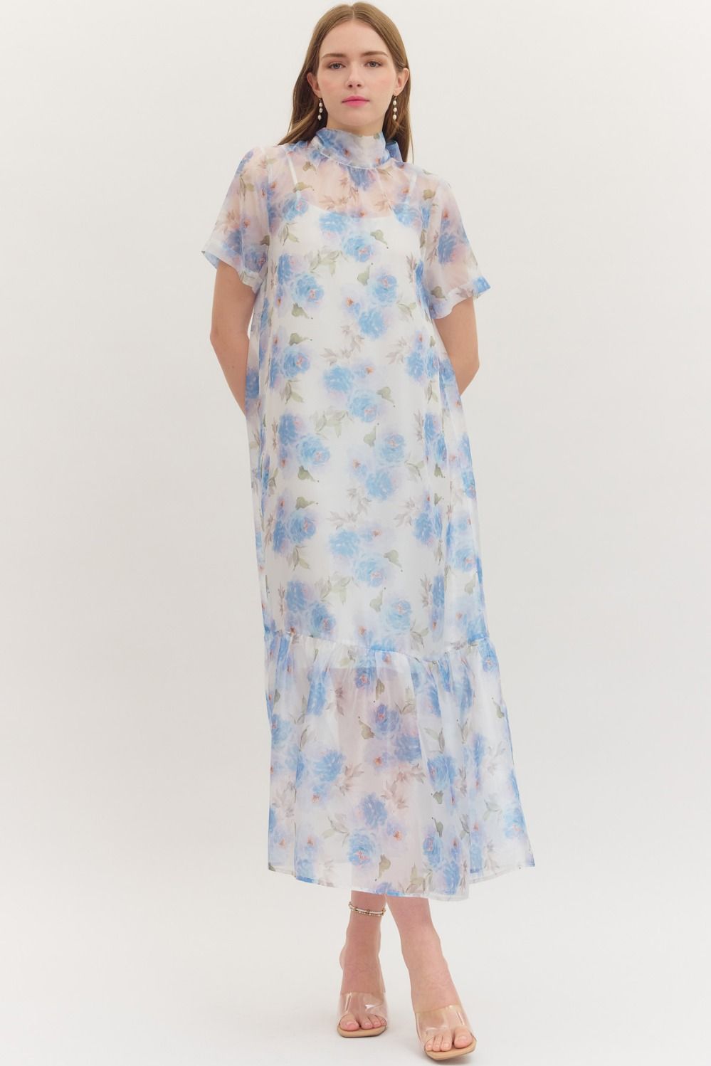 ENTRO Ollie floral printed short sleeve midi dress displayed on a hanger, showcasing its vibrant floral pattern and elegant design.