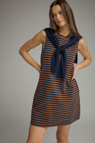 Ruby striped sweater overlay dress by ENTRO, casual 120 dress with a stylish layered sweater design and vibrant red and white stripes.